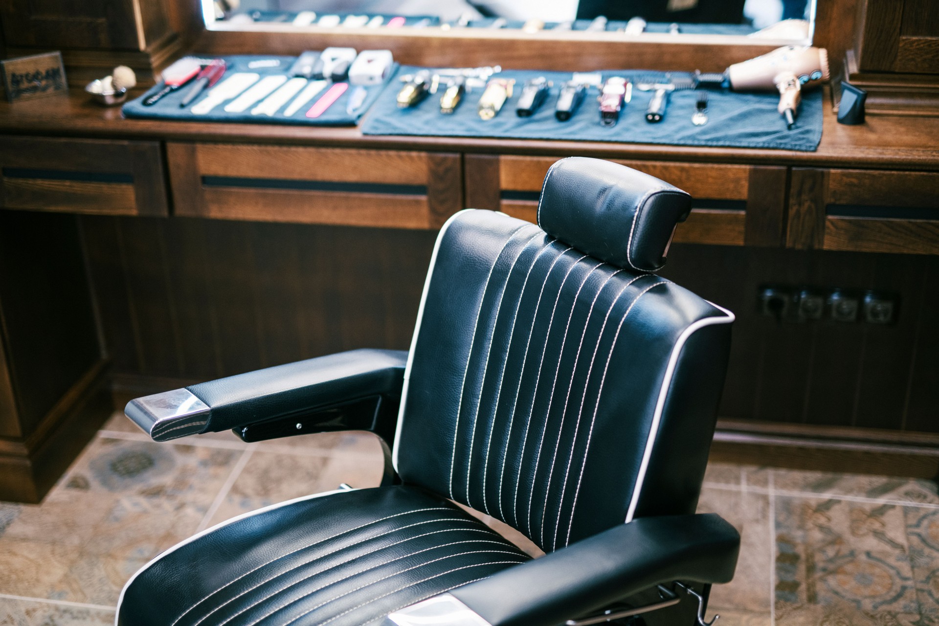 Empty hairdressing chair in retro barber shop.