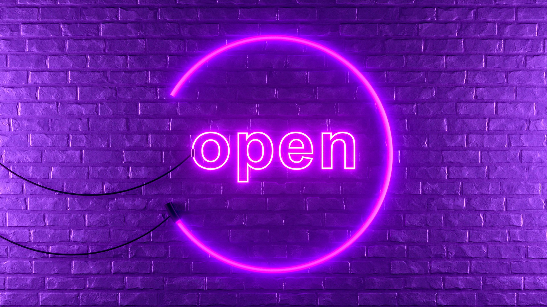 Open neon lighting sign on brick wall